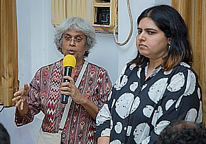 Foundation trustee, Shubhada Nikharge answering questions with project coordinator Sanjana Patil standing beside her